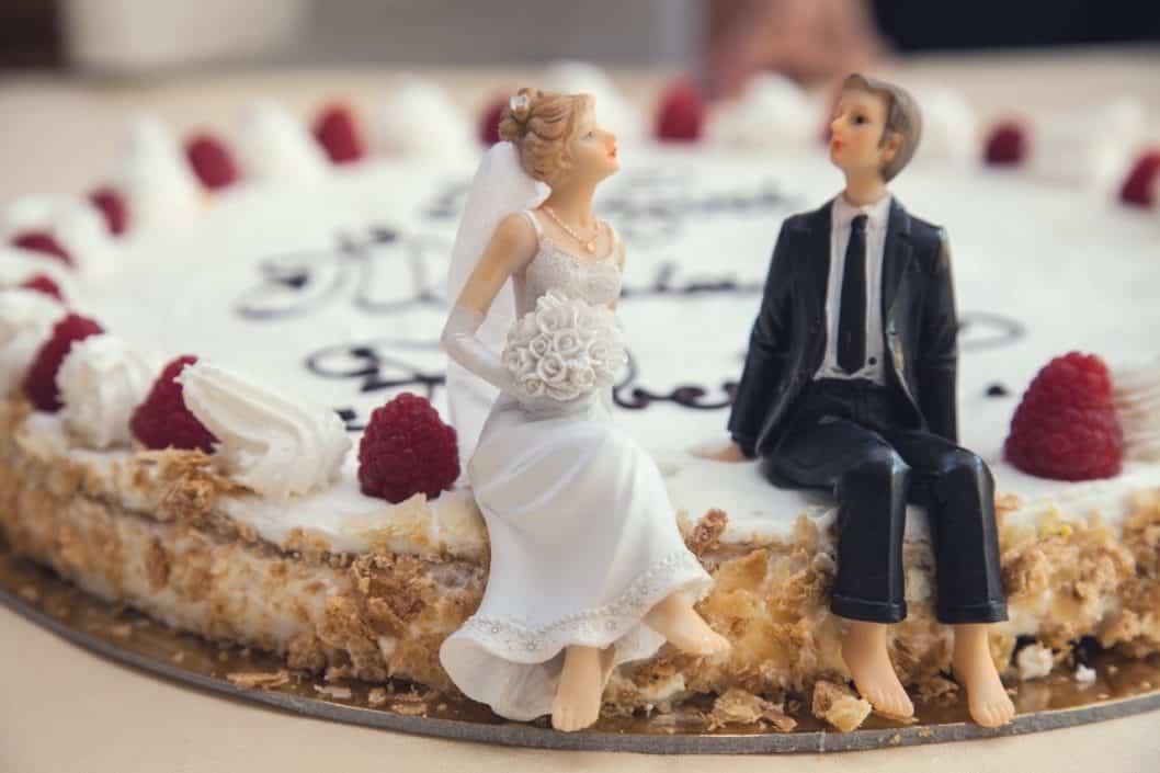 Wedding couple figurines on cake