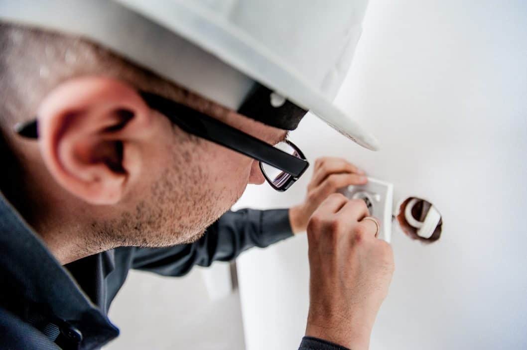 appliance repair technician doing his job